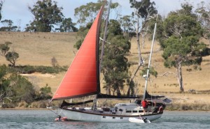 A sailing boat drifted onto the sand overnight last week while we were sleeping on our boat. Mal is in his little tender boat in the picture