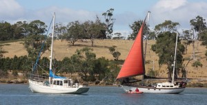 A larger boat came to the rescue, to tow the marooned boat off the sand and oyster shells.